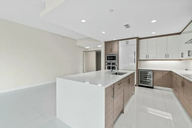 a bedroom with a bed chair and a large window