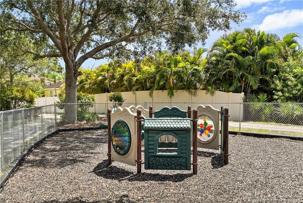 2119 Northwest Marsh Rabbit Lane Jensen Beach, FL 34957 - Photo 4 of 7 a view of a fireplace in a yard