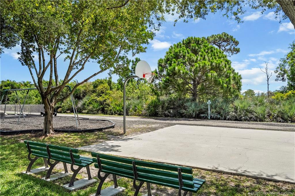 2119 Northwest Marsh Rabbit Lane Jensen Beach, FL 34957 - Photo 6 of 7 a view of a backyard with a patio
