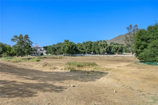 a view of a town with trees in the background