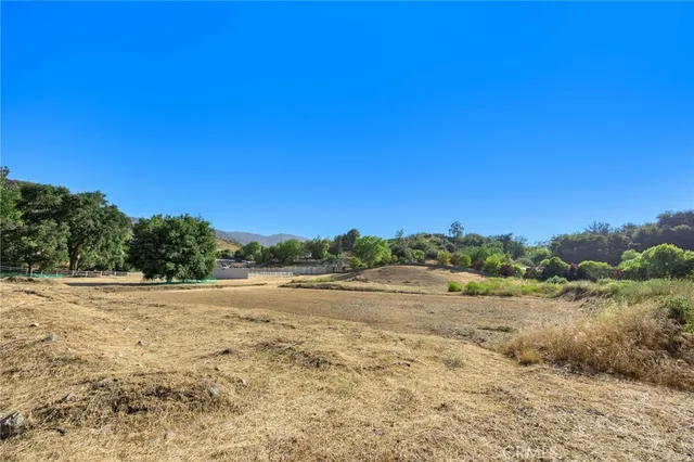 a view of ocean beach and mountain