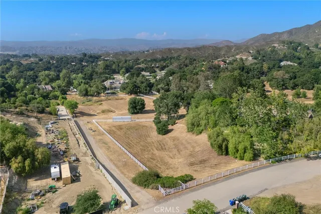 an aerial view of a house with mountain view