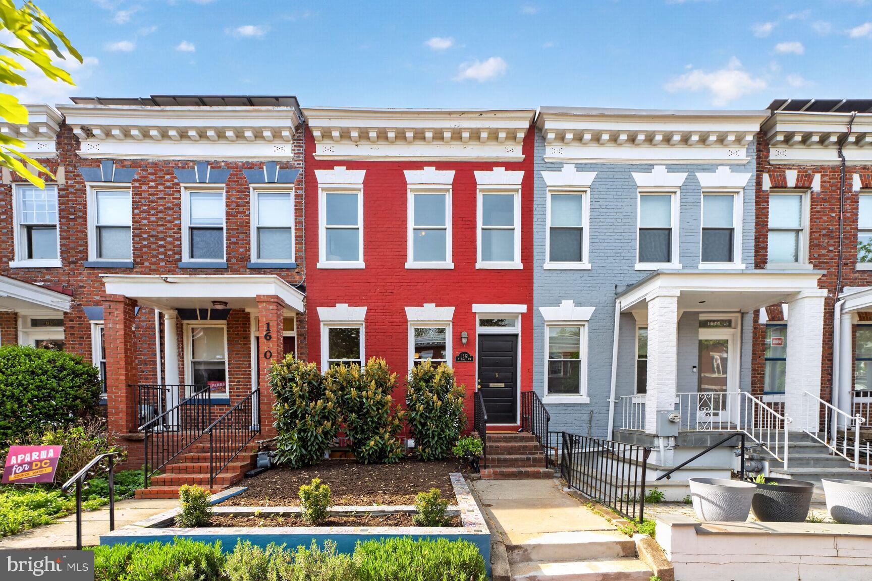 a front view of building with yard and swimming pool