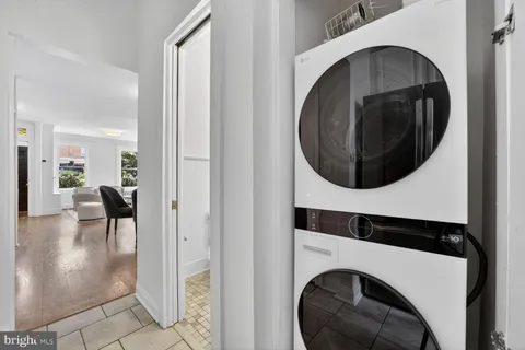a view of a hallway with washer and dryer