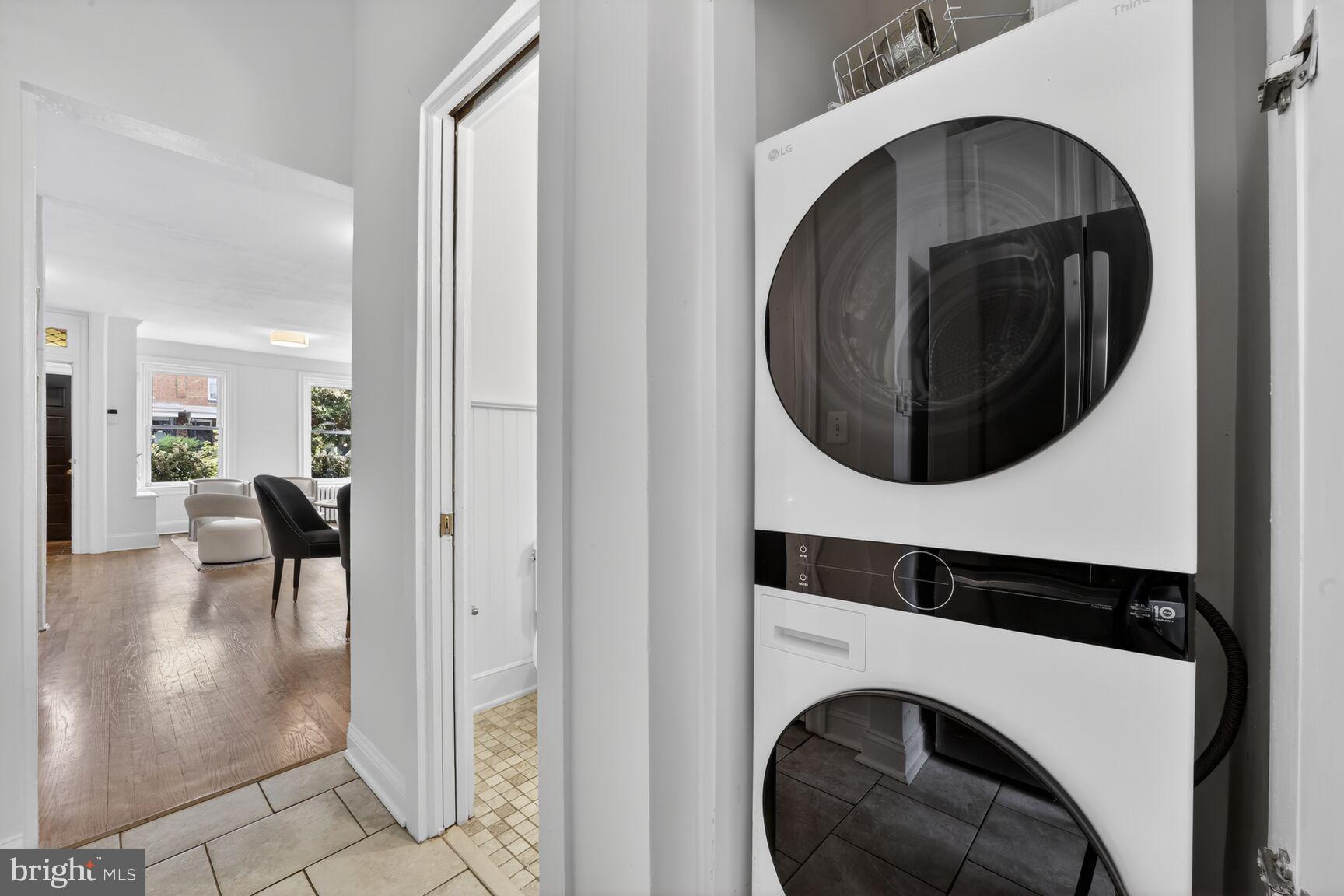 1612 V Street Northwest Washington, DC 20009 - Photo 19 of 29 a view of a hallway with washer and dryer