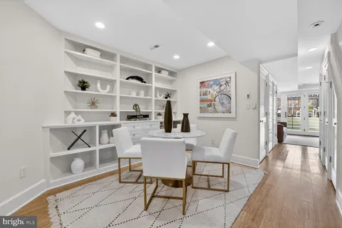 a dining room with a table and chairs in it