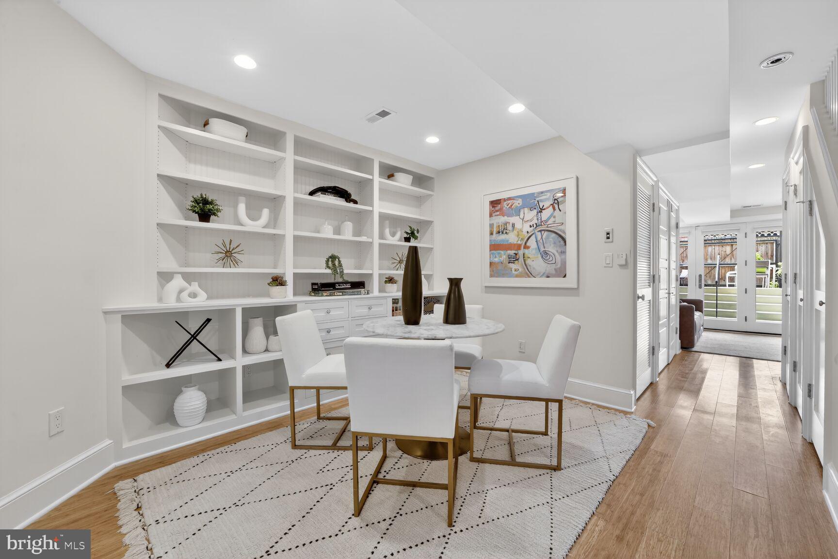 1612 V Street Northwest Washington, DC 20009 - Photo 20 of 29 a dining room with a table and chairs in it