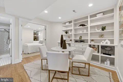 a dining room with a table and chairs