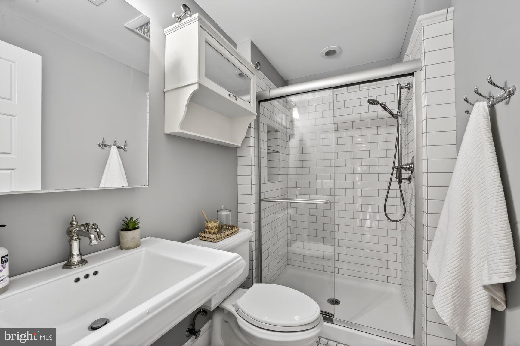 1612 V Street Northwest Washington, DC 20009 - Photo 24 of 29 a bathroom with a sink toilet and shower