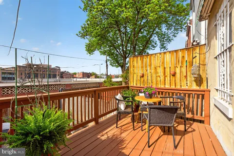 a view of a chairs on the roof deck