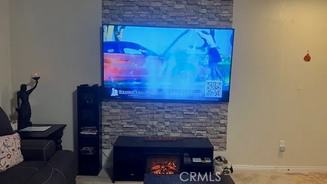 a kitchen with a stove a sink a dining table and chairs