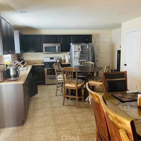 a kitchen with a sink and a refrigerator