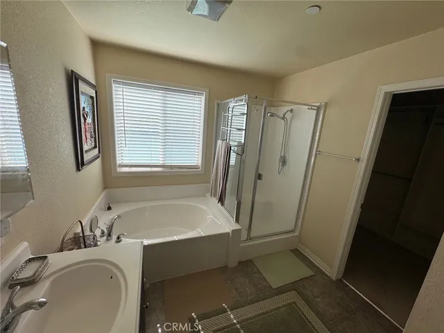 a bathroom with a sink a window and a mirror