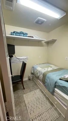 a room with wooden floor and shoes