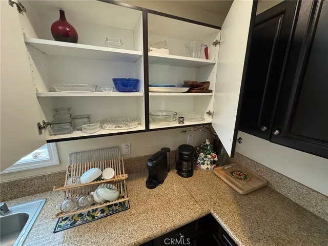 a bedroom with a bed and a large mirror