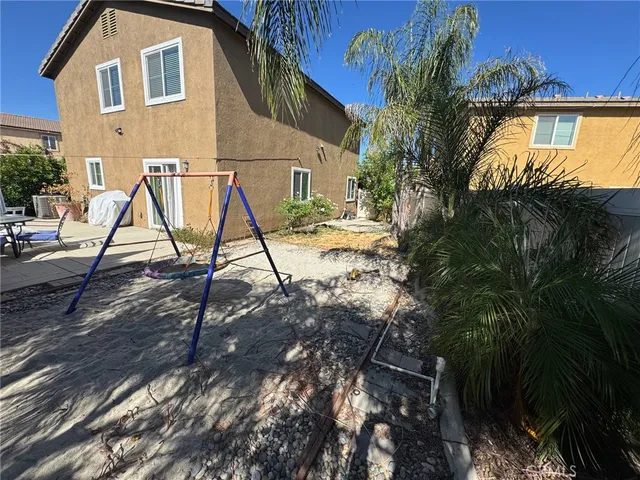 a view of a house with snow on the tree