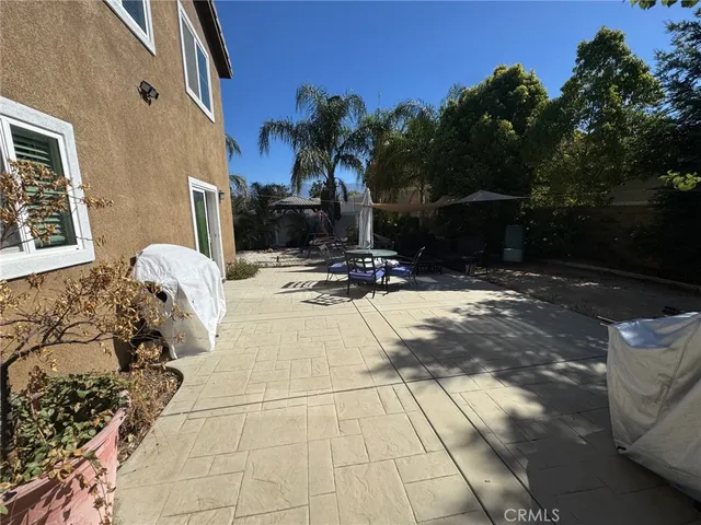 a view of patio with furniture