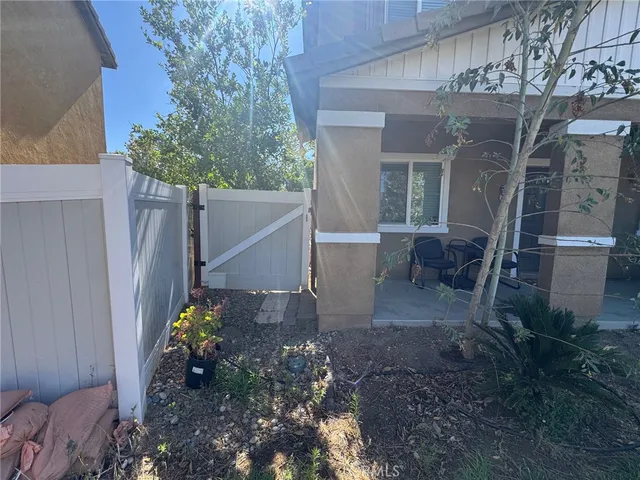 a view of a storage and utility room with washer and dryer