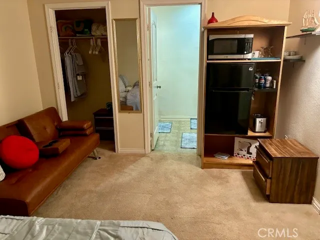 a bathroom with a glass door shower and a sink