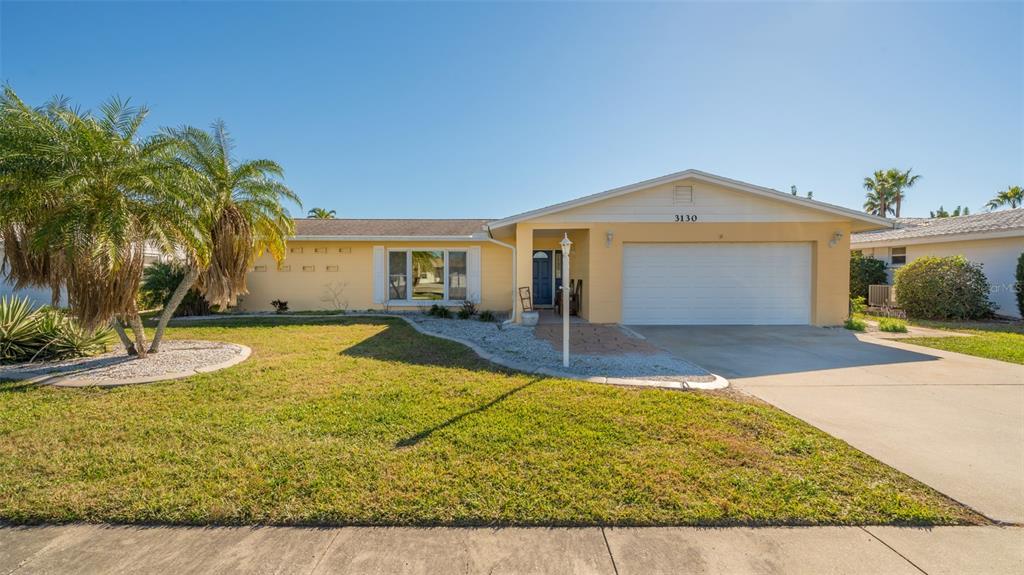 3130 Post Road Sarasota, FL 34231 - Photo 1 of 1 a front view of a house with swimming pool