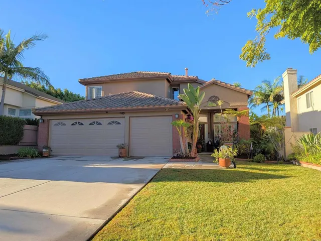 a front view of a building with a swimming pool