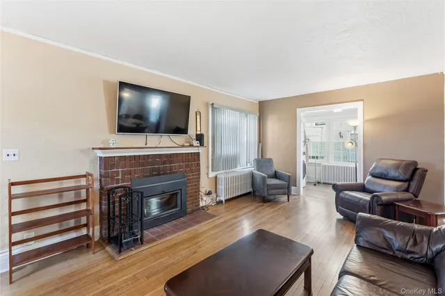 a living room with furniture fireplace and flat screen tv