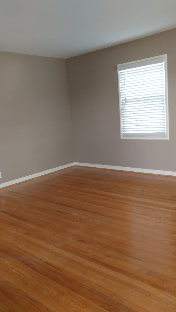 36871 Locust Street Newark, CA 94560 - Photo 3 of 14 a view of an empty room with wooden floor and a window