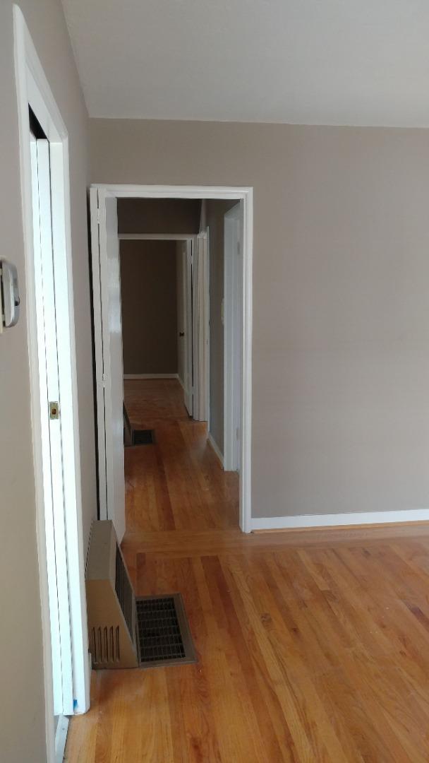 36871 Locust Street Newark, CA 94560 - Photo 4 of 14 a view of a hallway with wooden floor and entryway