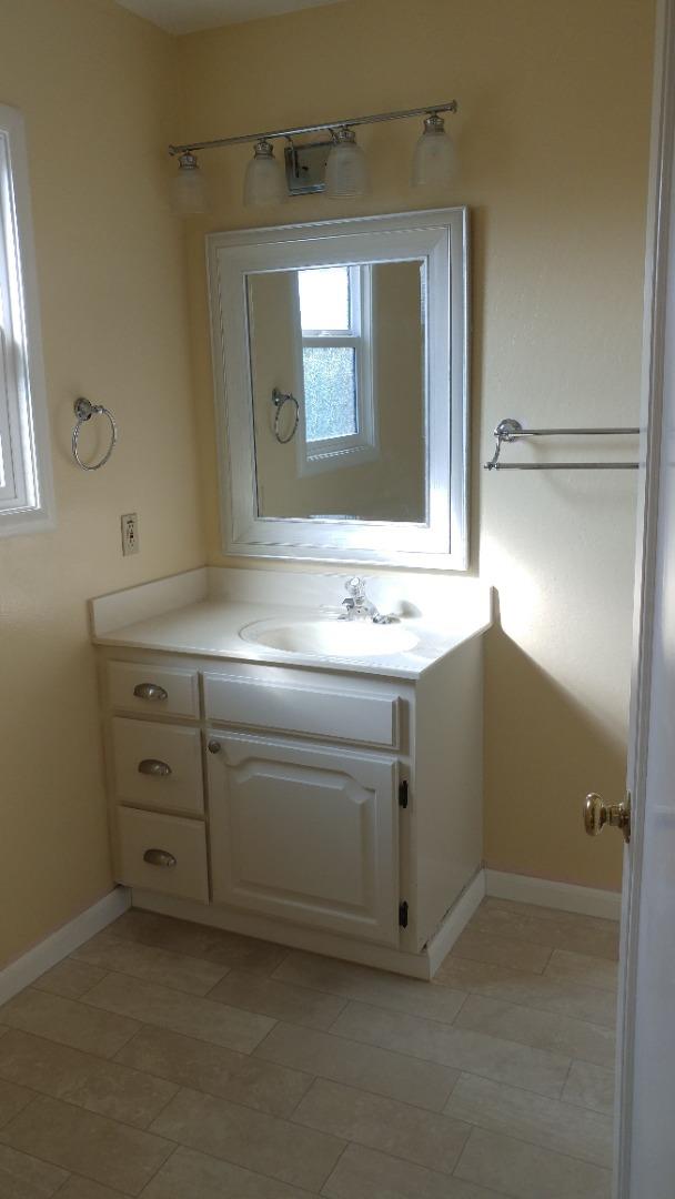 36871 Locust Street Newark, CA 94560 - Photo 7 of 14 a bathroom with a sink vanity and mirror