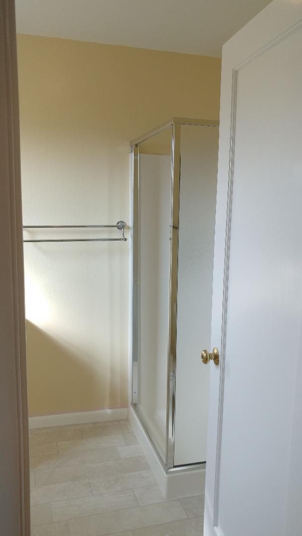 36871 Locust Street Newark, CA 94560 - Photo 8 of 14 a bathroom with a glass shower door
