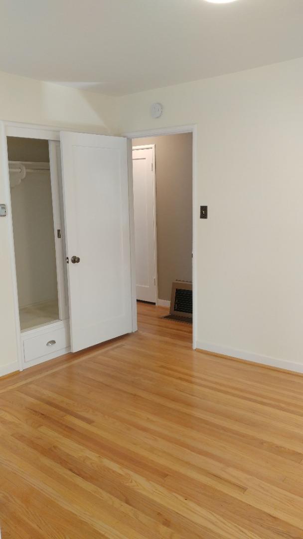 36871 Locust Street Newark, CA 94560 - Photo 9 of 14 a view of an empty room with wooden floor