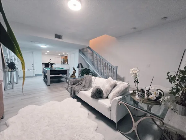 a living room with furniture and a table