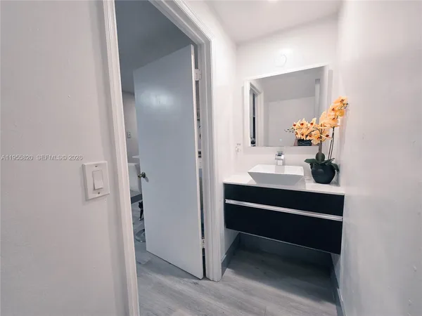 a bathroom with a sink and a mirror