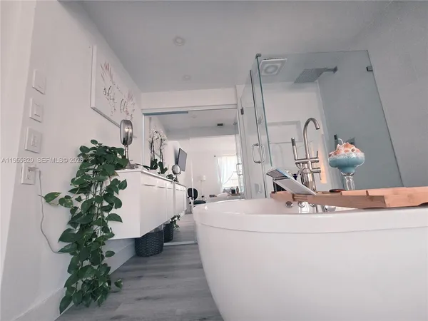 a room with a flower pot and a potted plant