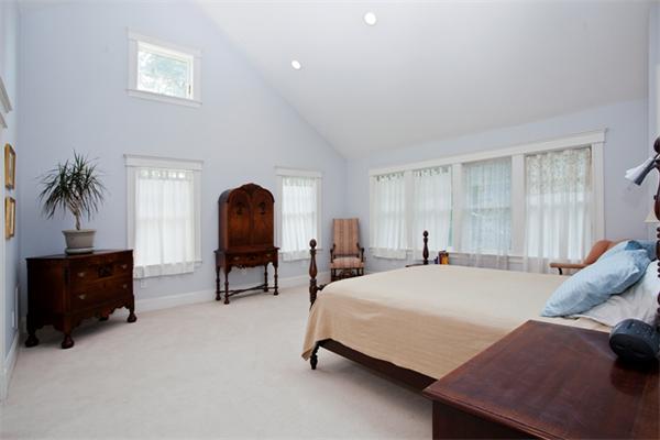 108 Albemarle Road Newton, MA 02460 - Photo 7 of 9 a bedroom with a bed and a potted plant