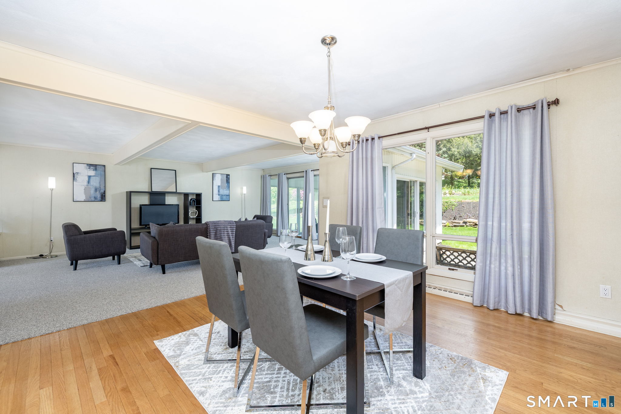 57 Jean Road Manchester, CT 06040 - Photo 11 of 38 a view of a dining room with furniture window and wooden floor