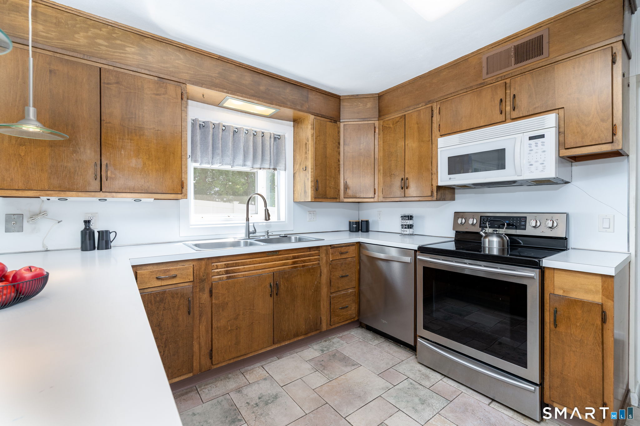 57 Jean Road Manchester, CT 06040 - Photo 13 of 38 a kitchen with stainless steel appliances granite countertop a sink and cabinets