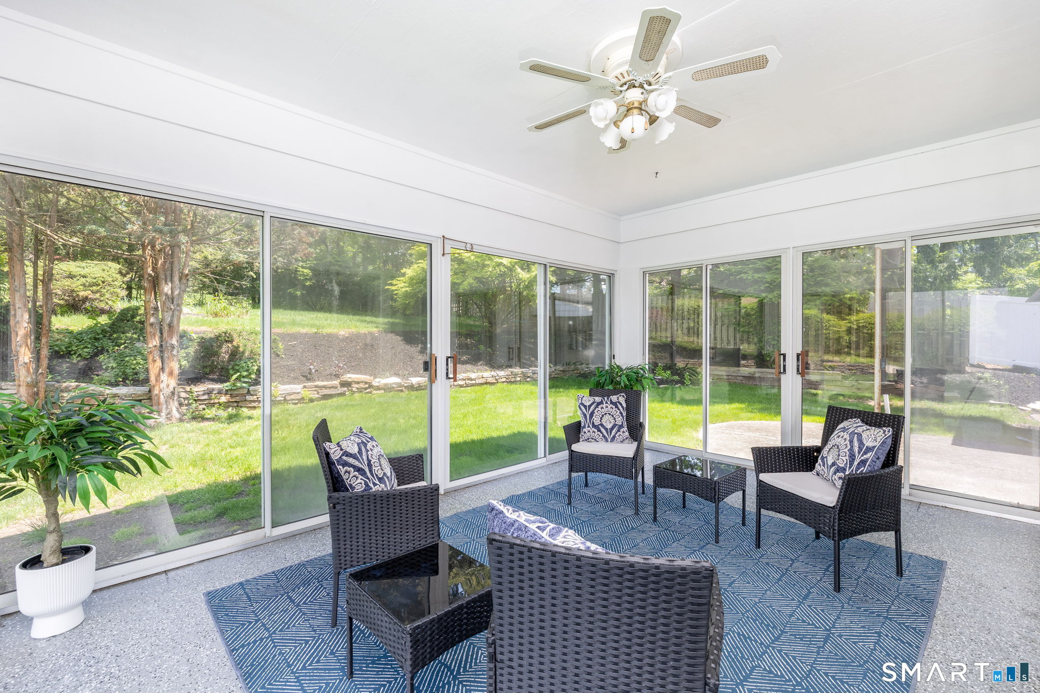 57 Jean Road Manchester, CT 06040 - Photo 19 of 38 a living room with furniture and a large window with garden view
