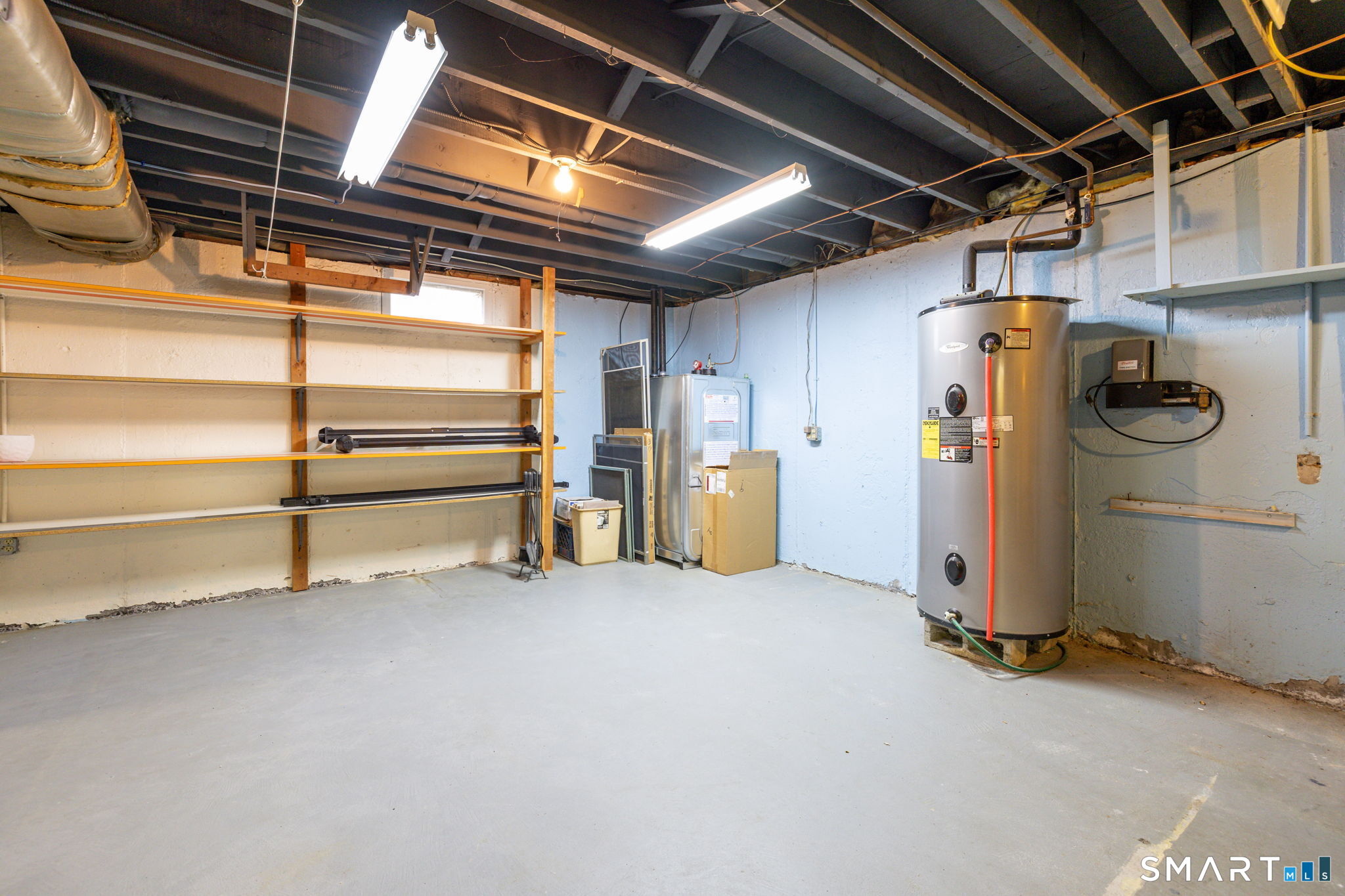 57 Jean Road Manchester, CT 06040 - Photo 31 of 38 a view of storage and utility room with racks