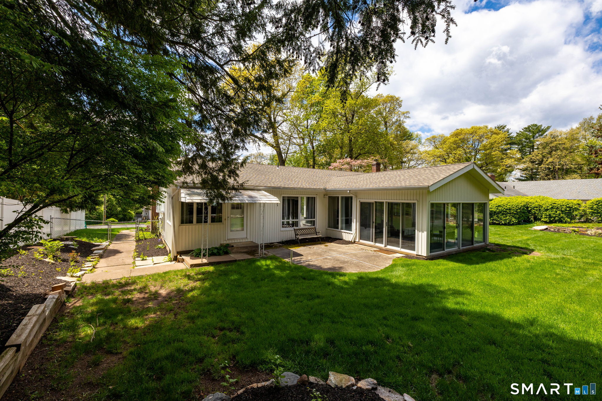 57 Jean Road Manchester, CT 06040 - Photo 34 of 38 a front view of a house with a garden and trees