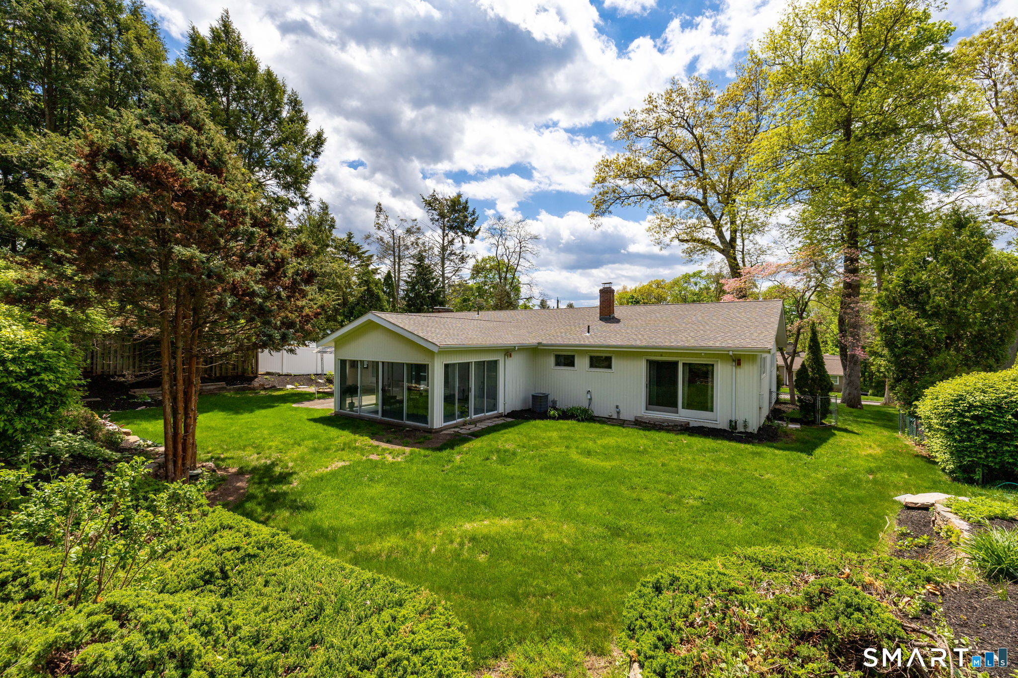 57 Jean Road Manchester, CT 06040 - Photo 36 of 38 a view of a house with a yard and large trees
