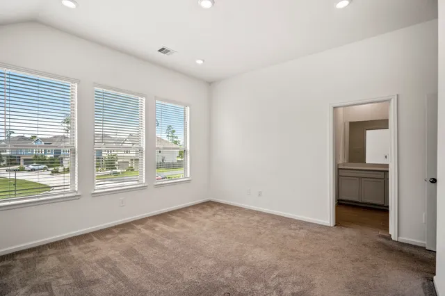 a bathroom with a shower sink and mirror