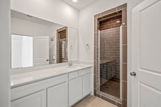 a view of a room with rack on the wall and a window