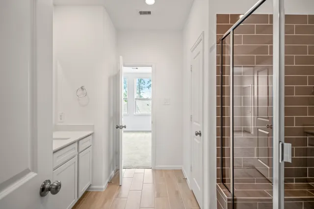 a view of an empty room and closet area