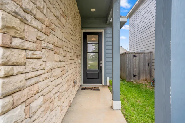 a view of a brick house with a large door