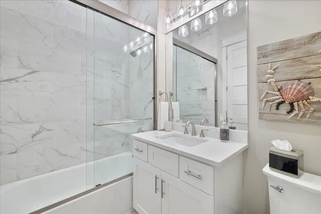 a bathroom with a double vanity sink mirror and shower