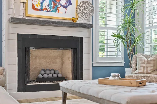 a bedroom with a bed and a potted plant