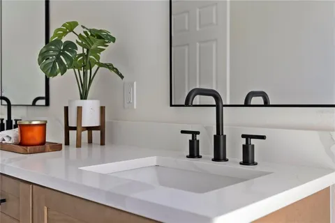 a vase of flowers sitting on a counter