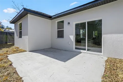 a view of a backyard of the house