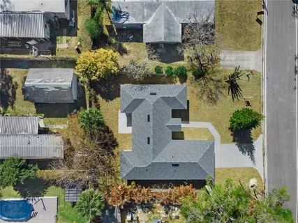 an aerial view of a house with outdoor space